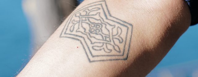 Athreya’s right arm bears a tattoo of his favorite translation surface — a double pentagon. (Radhika Govindrajan)