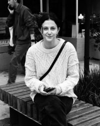 Black and white photo of Abigail Brauer sitting 