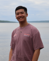 Bryan standing in front of Cayuga Lake.